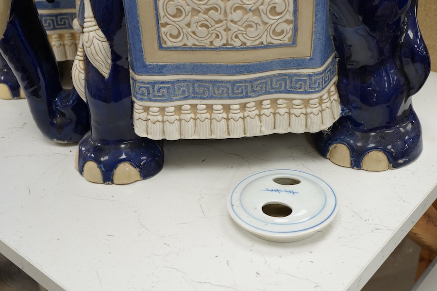 A pair of Chinese glazed earthenware 'elephant' stands, 42.5cm